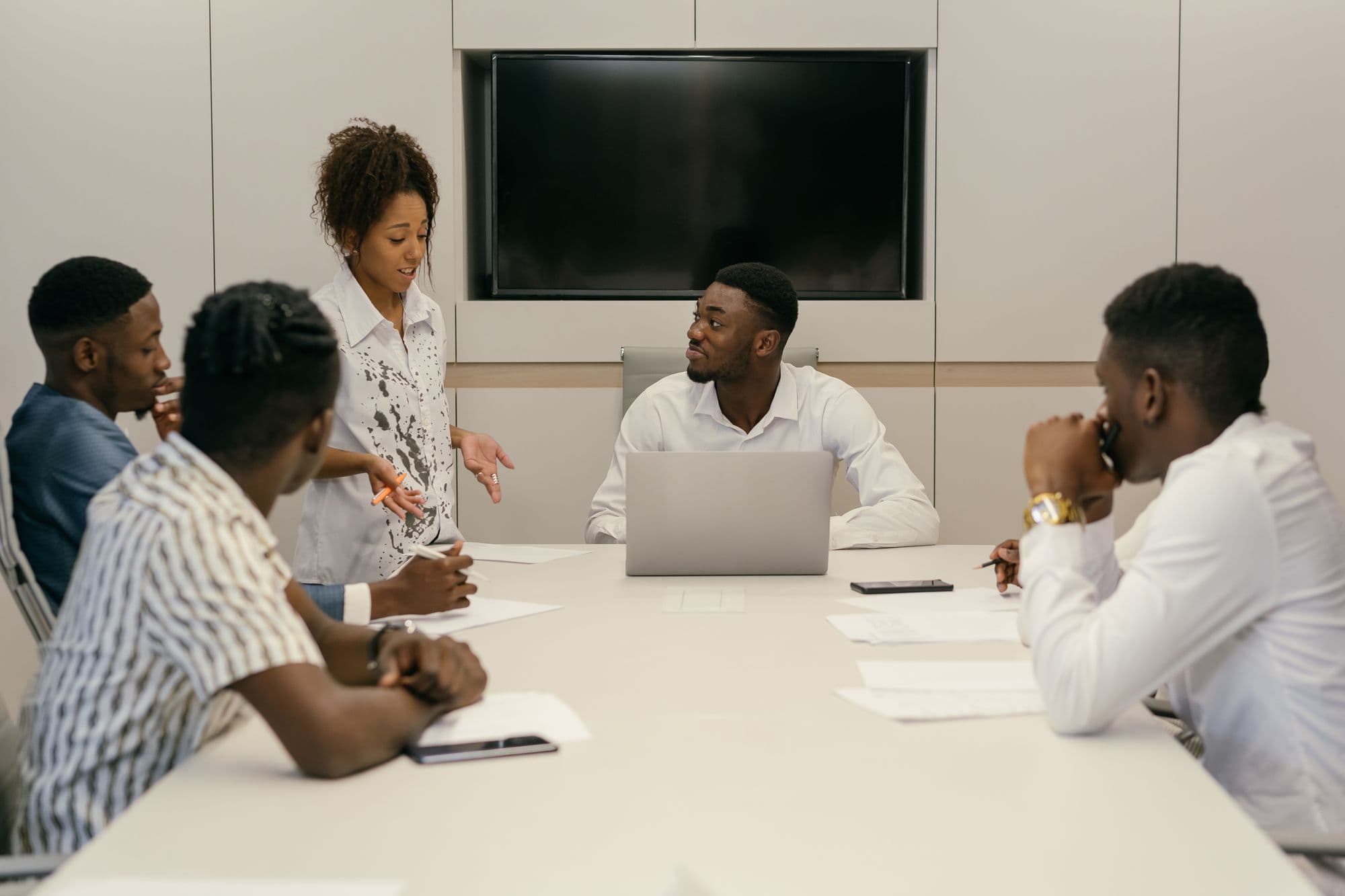 A team working through the day together around a meeting table